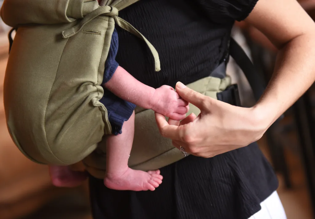 Holding hands with mum